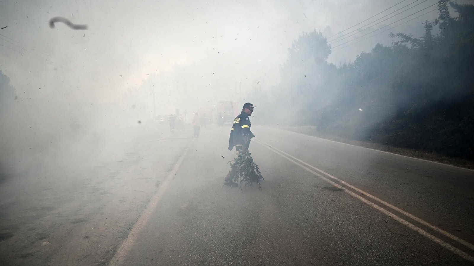 'Wall of fire' forces sea evacuation in Greece as wildfires continue across Europe
